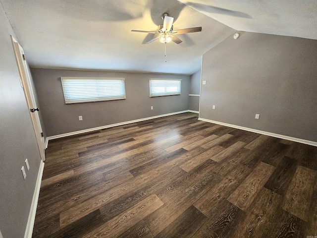 2715 Greenbriar Dr Apt B, Jonesboro, AR 72401 - unfurnished room featuring dark wood-style floors, ceiling fan, lofted ceiling, and baseboards