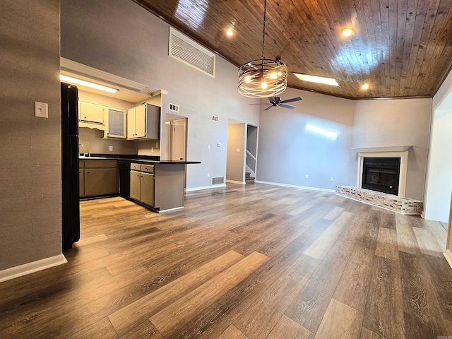 2715 Greenbriar Dr Apt B, Jonesboro, AR 72401 - unfurnished living room featuring a ceiling fan, wood ceiling, high vaulted ceiling, baseboards, and wood finished floors