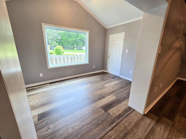 2715 Greenbriar Dr Apt B, Jonesboro, AR 72401 - empty room featuring wood finished floors, crown molding, vaulted ceiling, and baseboards