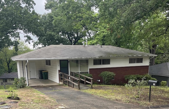 16 Southmont Dr, Little Rock, AR 72209 - ranch-style house with asphalt driveway, an attached carport, and brick siding