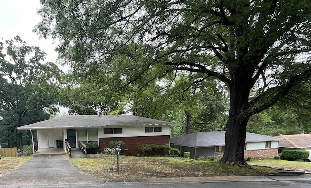 16 Southmont Dr, Little Rock, AR 72209 - ranch-style house with driveway, an attached carport, brick siding, and covered porch