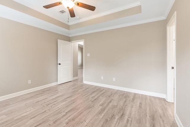 17 Woodhaven Dr, Cabot, AR 72023 - spare room with a raised ceiling, light wood-type flooring, a ceiling fan, crown molding, and baseboards