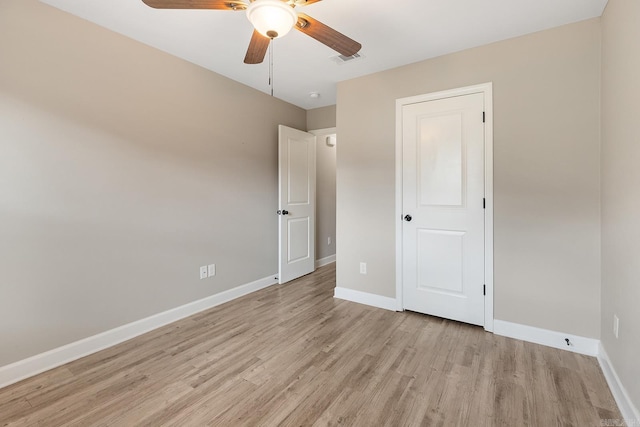 17 Woodhaven Dr, Cabot, AR 72023 - unfurnished bedroom featuring light wood finished floors, baseboards, and ceiling fan