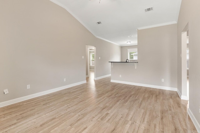 17 Woodhaven Dr, Cabot, AR 72023 - spare room with crown molding, baseboards, light wood finished floors, and lofted ceiling