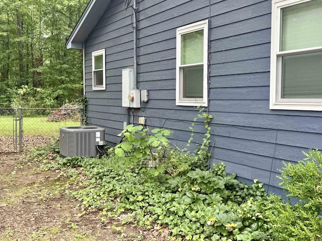 9925 Dublin Dr, Shannon Hills, AR 72103 - view of side of property featuring central AC unit