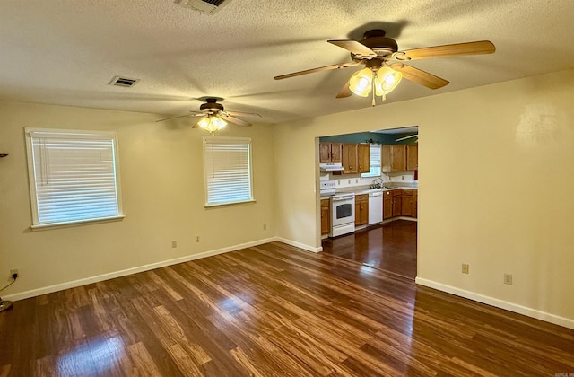 9925 Dublin Dr, Shannon Hills, AR 72103 - unfurnished living room with dark wood-type flooring, ceiling fan, a sink, and a textured ceiling