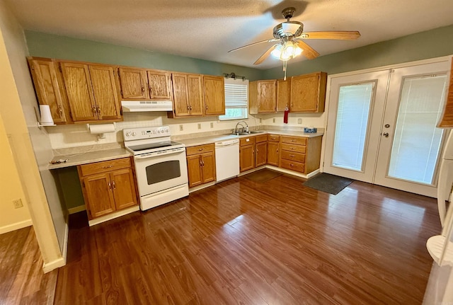 9925 Dublin Dr, Shannon Hills, AR 72103 - kitchen with white appliances, under cabinet range hood, light countertops, dark wood finished floors, and french doors