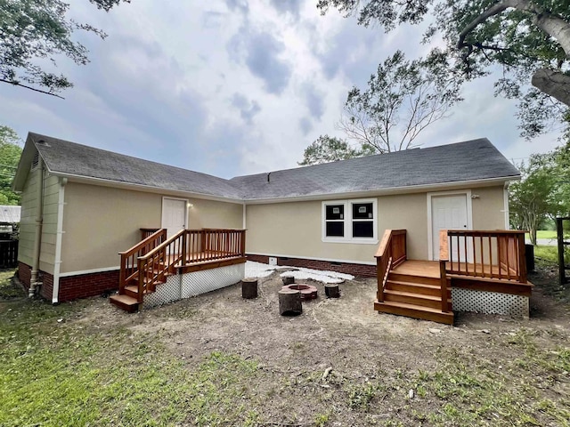 611 N Main St, Malvern, AR 72104 - rear view of property with an outdoor fire pit, a deck, crawl space, and roof with shingles