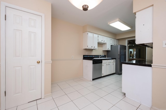 99 Kingsbridge Way, Little Rock, AR 72212 - kitchen featuring stainless steel appliances, a sink, white cabinets, tile counters, and baseboards