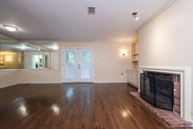 99 Kingsbridge Way, Little Rock, AR 72212 - unfurnished living room featuring crown molding, dark wood-style floors, a fireplace, baseboards, and french doors