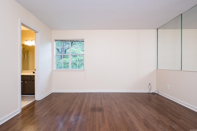 99 Kingsbridge Way, Little Rock, AR 72212 - empty room featuring dark wood finished floors and baseboards