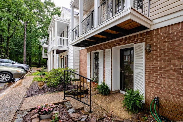 99 Kingsbridge Way, Little Rock, AR 72212 - property entrance with a balcony and brick siding