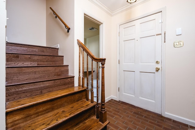 99 Kingsbridge Way, Little Rock, AR 72212 - foyer featuring brick flooring, baseboards, ornamental molding, and stairs