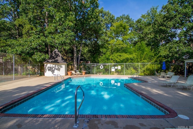 99 Kingsbridge Way, Little Rock, AR 72212 - community pool with a patio and view of scattered trees