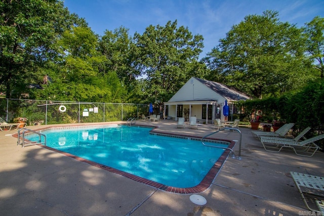 99 Kingsbridge Way, Little Rock, AR 72212 - community pool featuring a patio area and view of scattered trees