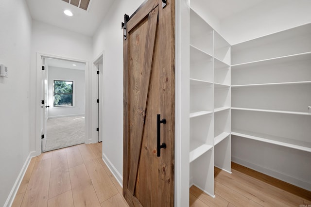 284 Shiloh, Beebe, AR 72102 - corridor with a barn door, hardwood / wood-style floors, baseboards, and recessed lighting