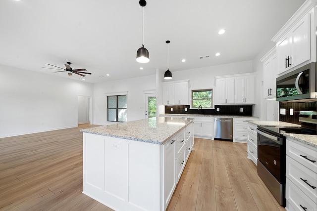 284 Shiloh, Beebe, AR 72102 - kitchen with stainless steel appliances, a ceiling fan, light wood-style floors, white cabinets, and tasteful backsplash