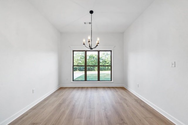 284 Shiloh, Beebe, AR 72102 - unfurnished room featuring a chandelier, light wood finished floors, and baseboards