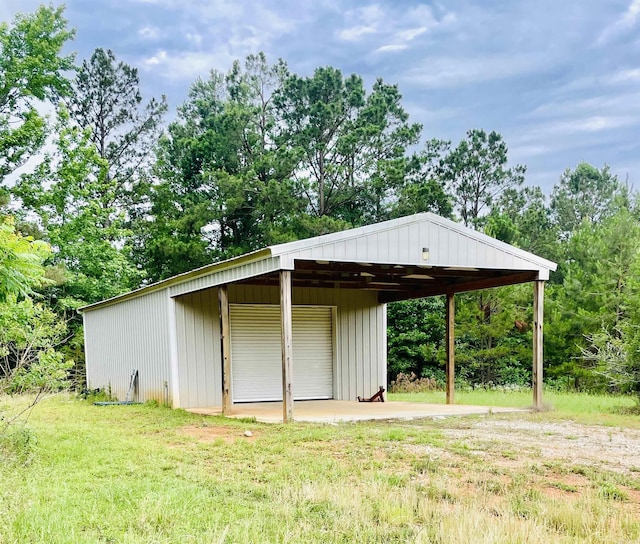 2441 Miller County 77, Doddridge, AR 71834 - view of pole building featuring a yard and view of wooded area