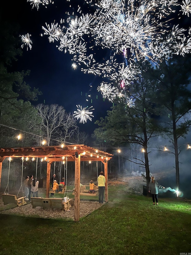 2441 Miller County 77, Doddridge, AR 71834 - yard at twilight featuring a lawn