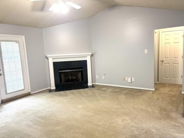 54 Redleaf Crk, Little Rock, AR 72210 - unfurnished living room featuring carpet floors, a ceiling fan, vaulted ceiling, baseboards, and a tile fireplace
