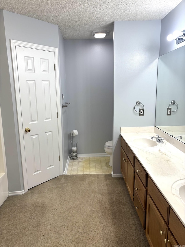 54 Redleaf Crk, Little Rock, AR 72210 - full bathroom with double vanity, toilet, carpet, a textured ceiling, and baseboards