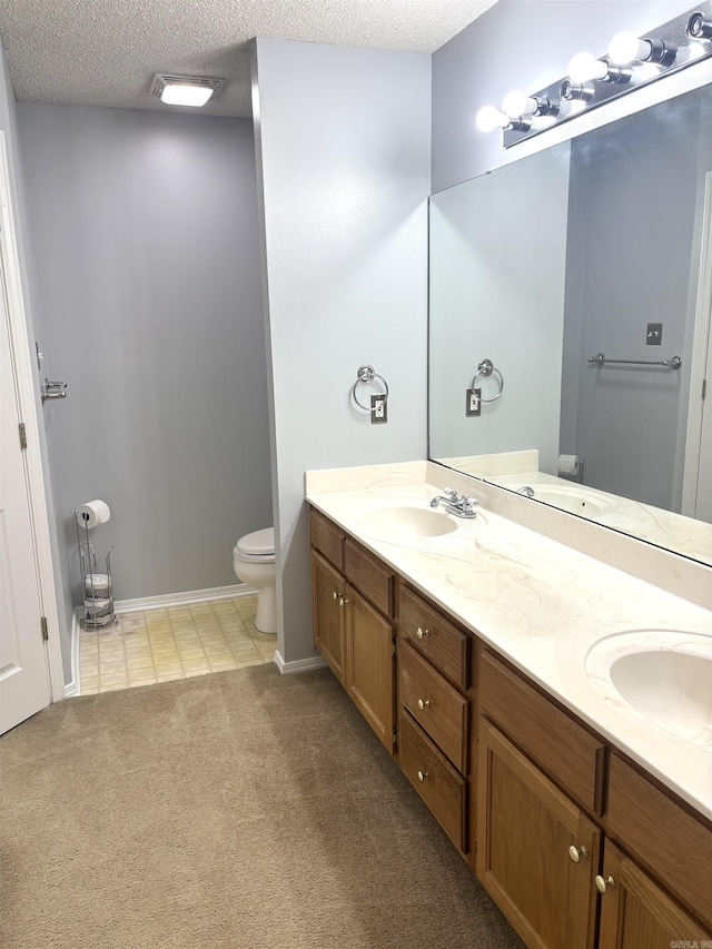 54 Redleaf Crk, Little Rock, AR 72210 - full bath featuring toilet, double vanity, baseboards, a textured ceiling, and tile patterned flooring