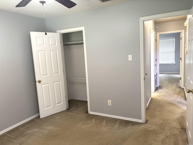 54 Redleaf Crk, Little Rock, AR 72210 - unfurnished bedroom featuring carpet floors, a closet, baseboards, ceiling fan, and a textured ceiling