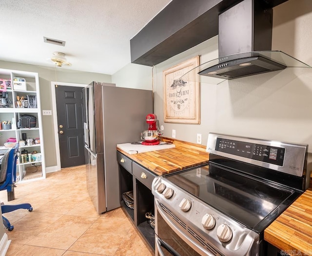 12 Wickford Ln, Little Rock, AR 72212 - kitchen with appliances with stainless steel finishes, wall chimney range hood, and light tile patterned flooring