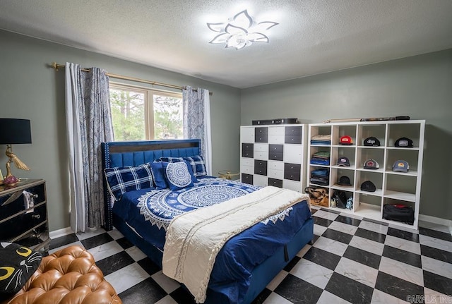 12 Wickford Ln, Little Rock, AR 72212 - bedroom featuring a textured ceiling, tile patterned floors, and baseboards