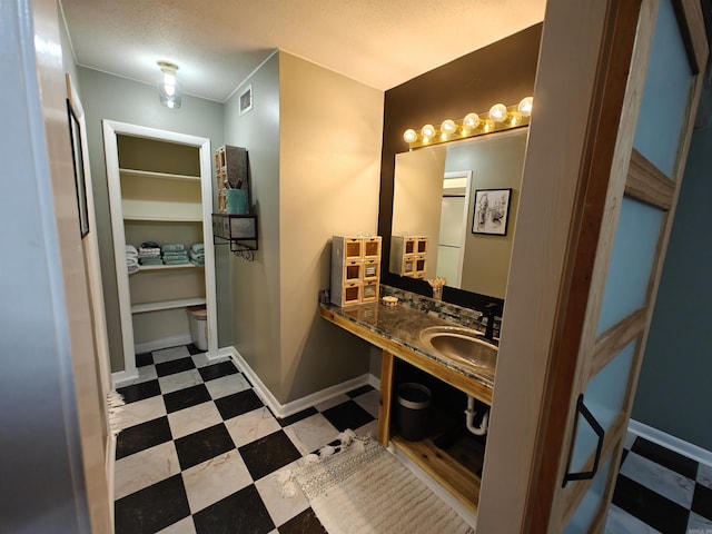 12 Wickford Ln, Little Rock, AR 72212 - bathroom with a sink, toilet, baseboards, and tile patterned floors