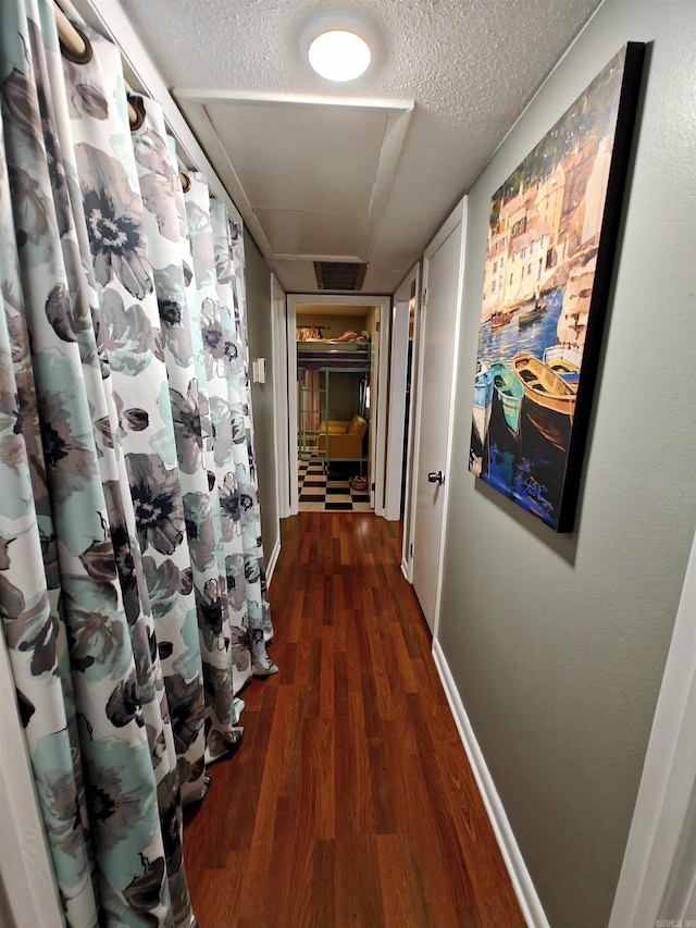 12 Wickford Ln, Little Rock, AR 72212 - hall with wood finished floors, a textured ceiling, and baseboards