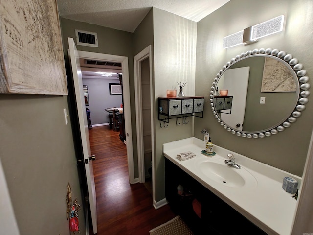 12 Wickford Ln, Little Rock, AR 72212 - bathroom featuring wood finished floors, vanity, and baseboards