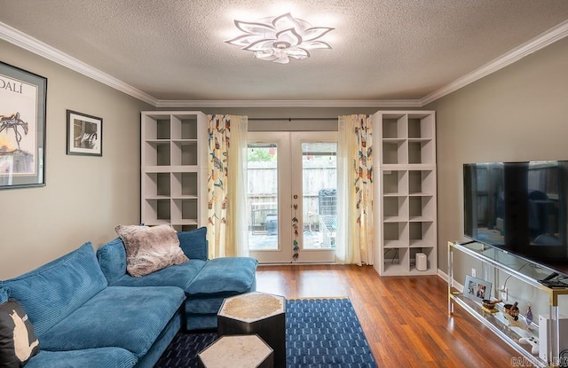 12 Wickford Ln, Little Rock, AR 72212 - living area featuring wood finished floors, ornamental molding, a textured ceiling, and french doors