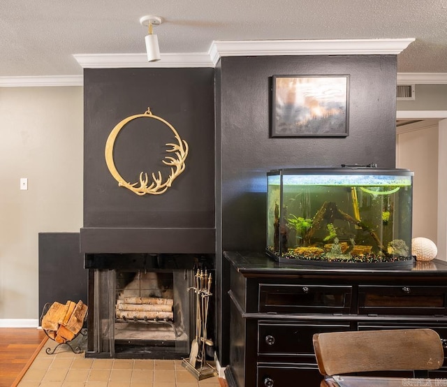 12 Wickford Ln, Little Rock, AR 72212 - detailed view of ornamental molding, a fireplace, and a textured ceiling