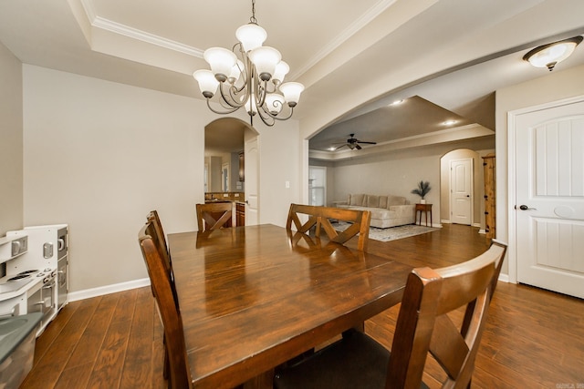 3305 Garden Club Dr, Bryant, AR 72022 - dining area featuring arched walkways, a tray ceiling, a ceiling fan, and ornamental molding