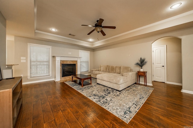 3305 Garden Club Dr, Bryant, AR 72022 - living room with a ceiling fan, a raised ceiling, crown molding, baseboards, and dark wood-style floors