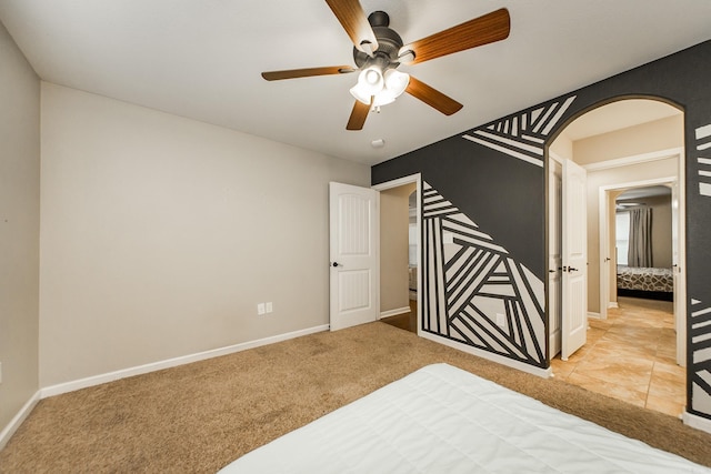 3305 Garden Club Dr, Bryant, AR 72022 - bedroom with carpet flooring, arched walkways, and baseboards
