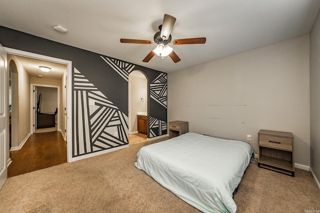 3305 Garden Club Dr, Bryant, AR 72022 - carpeted bedroom featuring arched walkways, baseboards, and ceiling fan