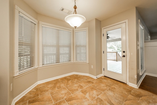 3305 Garden Club Dr, Bryant, AR 72022 - unfurnished dining area with baseboards and a ceiling fan