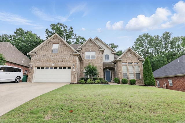 12714 Meadows Edge Ln, Little Rock, AR 72211 - traditional-style home featuring brick siding, driveway, a front lawn, and an attached garage