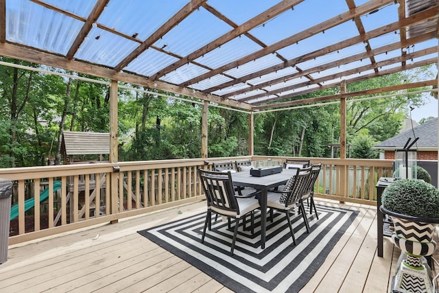 12714 Meadows Edge Ln, Little Rock, AR 72211 - wooden deck featuring outdoor dining area and view of scattered trees