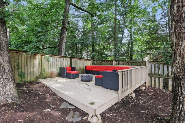 12714 Meadows Edge Ln, Little Rock, AR 72211 - wooden terrace with an outdoor hangout area, a fenced backyard, and view of scattered trees