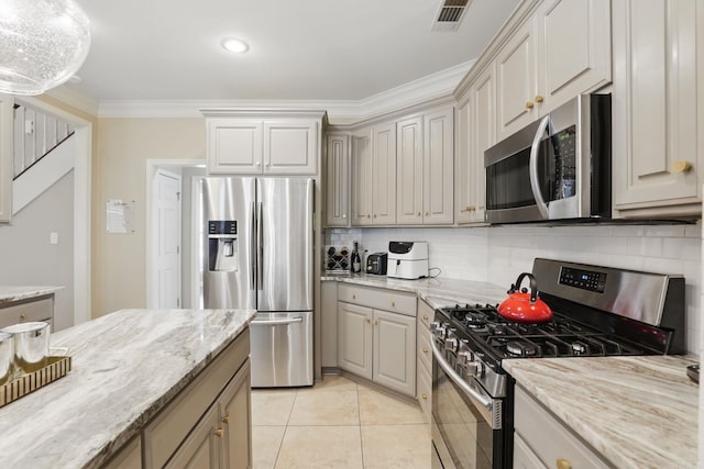 12714 Meadows Edge Ln, Little Rock, AR 72211 - kitchen with stainless steel appliances, decorative backsplash, light tile patterned flooring, light stone countertops, and crown molding