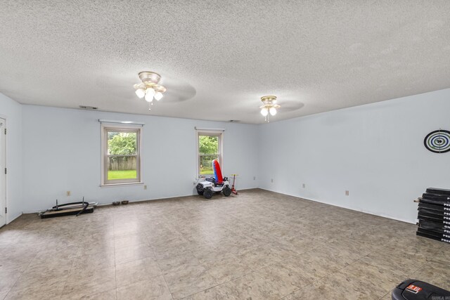 303 Pike Rd, Benton, AR 72019 - empty room with ceiling fan and a textured ceiling