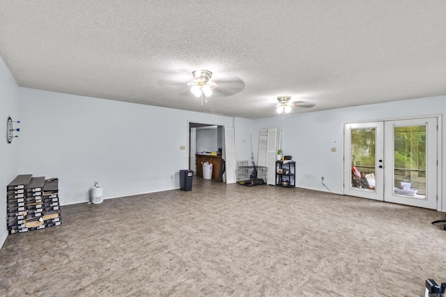 303 Pike Rd, Benton, AR 72019 - unfurnished living room featuring french doors, a ceiling fan, a textured ceiling, and tile patterned floors