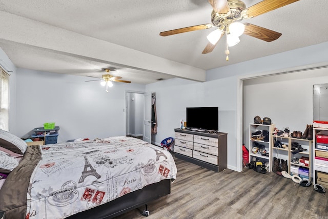 303 Pike Rd, Benton, AR 72019 - bedroom with wood finished floors, a textured ceiling, and ceiling fan