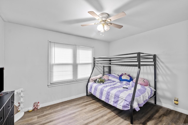 303 Pike Rd, Benton, AR 72019 - bedroom with wood finished floors, baseboards, and ceiling fan