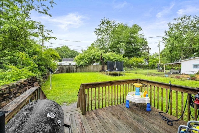 303 Pike Rd, Benton, AR 72019 - wooden deck with a trampoline