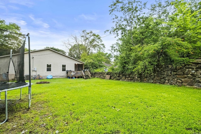 303 Pike Rd, Benton, AR 72019 - view of green lawn featuring a trampoline, a deck, and stairway